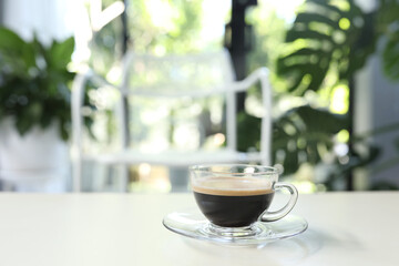 Coffee glass cup on white table indoor drinking