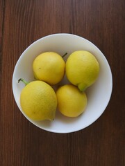 Lemons , lemons on a white plate. View from above. Selected focus lemons. Lemon and healthy eating concept.
İsolated photo