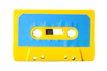 An old vintage cassette tape from the 1980s (obsolete music technology). Electric yellow plastic...