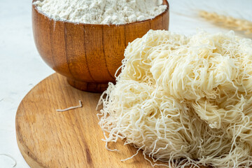 Kataifi dough, close-up, raw, white table.