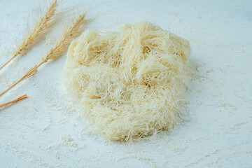 Qadaif dough on a light table, qadaif dough.