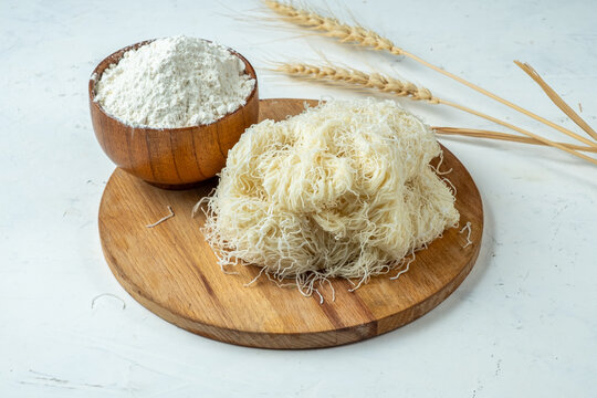 Dough from thin threads, kataifi, kadaif, light background.