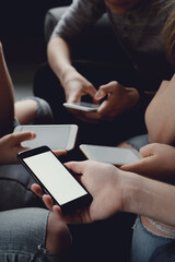 Group of friends having fun with smartphones