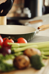 Different, fresh vegetables consisting of broccoli, tomatoes, celery, potatoes, onions and peppers