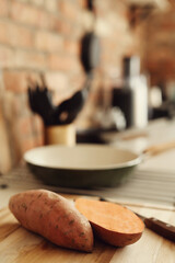Fresh, sweet, sliced sweet potato on the kitchen table
