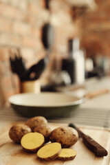 Fresh, sweet, sliced potatoes on the kitchen table