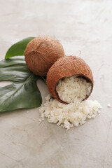 Composition with coconuts and  green leaves on a marbel surface