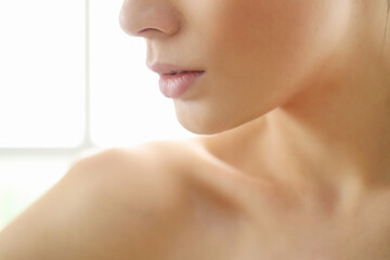 Cropped view of a female face with beautiful lips and cheeks