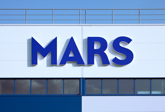 Poznan, Poland - August 27, 2022. Mars, Incorporated Logo On Its Chewing Gum Factory. Mars Is An American Multinational Manufacturer Of Confectionery, Pet Food, And Other Food Products.