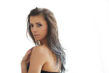 Obraz premium Photo of a beautiful,brunette woman with blue manicure posing and looking into the camera
