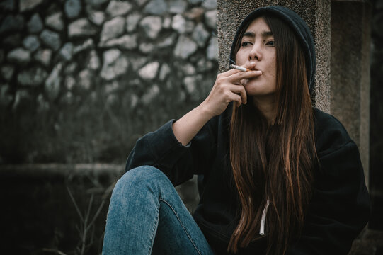 Portrait of addict drug asian woman,alcoholic woman concept