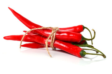 Whole tied red chili peppers on white background