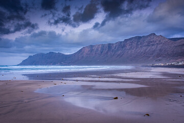 The amazing Famara beach on the Atlantic Ocean in Lanzarote, Canary Islands,  Spain