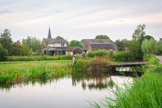 Idyllic image of the village of Reeuwijk-Dorp and the surrounding watery countryside
