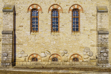 Windows of an ancient stone building of classical architecture. Background with selective focus and copy space
