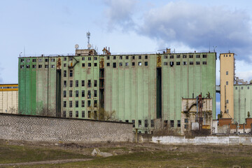 The building of a destroyed and abandoned plant or factory. Background with selective focus and copy space