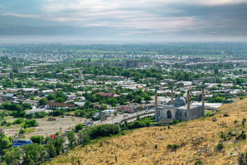Osh, Kyrgyzstan - May 2022: Osh cityscape as seen from Suleiman mountain. Osh is the second largest city in Kyrgyzstan, located in the Fergana Valley in the south of the country