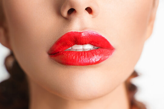 Close-up Beautiful lips. Sexy plump lips which red lipstick.