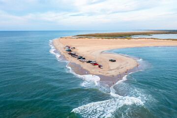 Aerial View of trucks on the beach and people fishing at Cape Point in Hatteras North Carolina