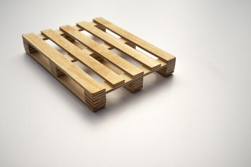 Construction wooden pallet on white isolate. Wooden stand for the load. Pallet for the loader.Cargo transportation.