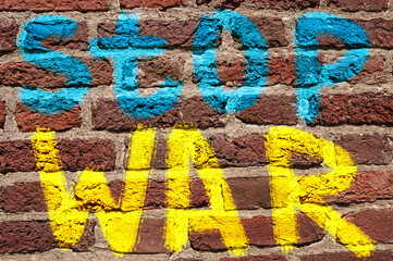 Stop war  text on brick wall. Stop war against Ukraine