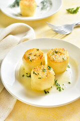 Fondant potatoes on plate
