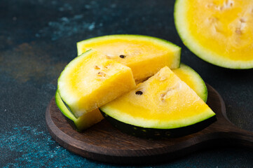Cut yellow watermelon on table. Fresh summer food. Healthy nutrition