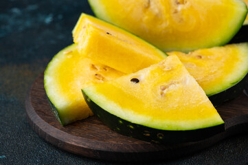 Cut yellow watermelon on table. Fresh summer food. Healthy nutrition