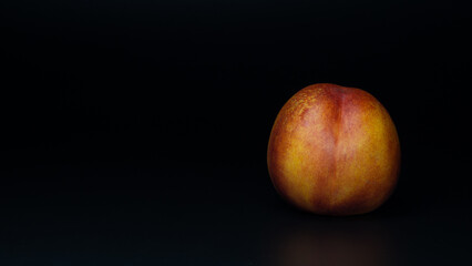 Fototapeta na wymiar peach on black background