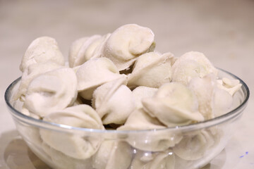 Appetizing frozen dumplings in a glass plate for vegan
