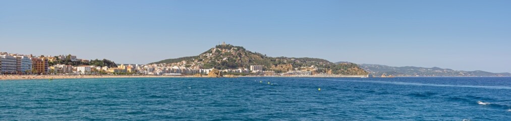Fototapeta na wymiar Coastline with Blanes beach towards Castle of Sant Joan, Catalonia.