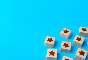 Scattered star blocks on a blue background. Feedback. Inspection, review. Benefits, positive...