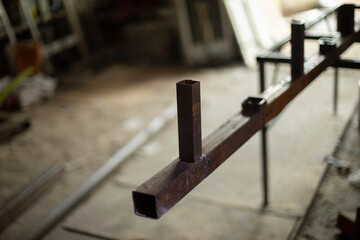 Metal processing in garage. Steel billet in garage.
