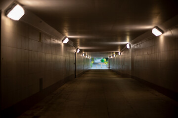 Tunnel in city. Light in tunnel under road.