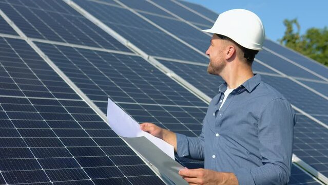 Engineers checking solar panels. Alternative energy ecological concept