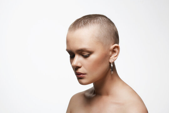sad woman with short haircut. portrait of adult age bald woman