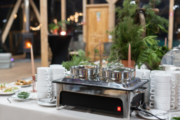 Food trays in buffet. metal containers buffet table.