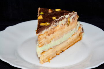 Cream cake made from pistachio on a plate