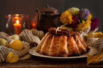 Cozy autumn still life with warm homemade biscuit apple pie and hot drink with marshmallow
