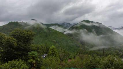 Cloud covered lush green hills