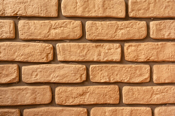 Sand colored decorative brick wall texture bg