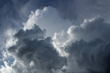Dramatic dark and moody monsoon clouds in the Sonoran Desert during the month of August, 2022. Beautiful multilayered heavenly cloudscapes. Pima County, Tucson, Arizona, USA.