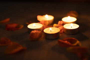 Rose petals and a set of scented candles, a romantic evening.