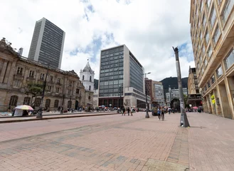 Fototapeten a landscape view of Jimenez avenue with 8th street corner, central bank and san francisco palace buildings at background at bogota, colombia downtown in sunny day © Alejandro Bernal