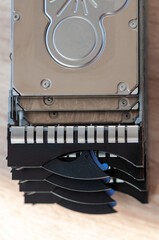 Close-up of a 2.5'' HDD server caddy tray stacked on each other on a table