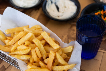 Israel and Lebanon cuisine served in restaurant. Middle eastern or Arabic Oriental restaurant. Several appetizer dishes and spreads for bread, potato chips and salad. 