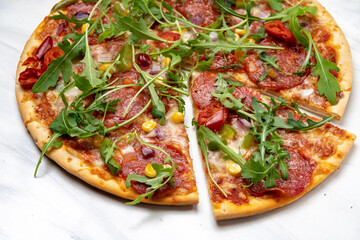 Pizza pepperoni with salami and arugula vegetables