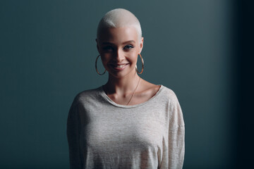 Millenial young smiling woman with short blonde hair portrait