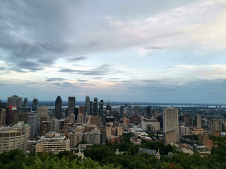 Fototapeta na wymiar Mount Royal hill mountain hike viewpoint over the city skyline by night evening in toronto canada