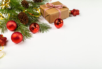 Christmas card with fir branches and Christmas decorations.